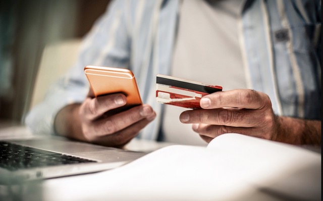 Man paying by card over the phone